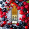 RandM Tornado Pro Liquid Mixed Berries Vape Liquid mit Beerenmix Aromen im Hintergrund