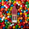 RandM Tornado Pro Liquid Skittles Vape Liquid mit fruchtigen Bonbon Aromen im Hintergrund