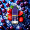 RandM Tornado Pro Liquid Strawberry Grape Vape Liquid mit Erdbeere und Traube Aromen im Hintergrund